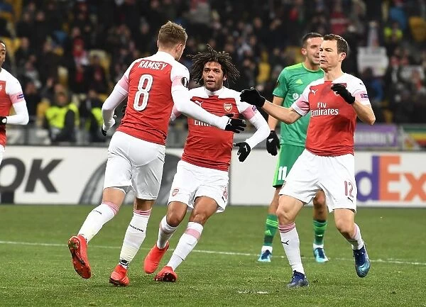 Arsenal's Aaron Ramsey, Mohamed Elneny, and Stephan Lichtsteiner Celebrate Goals Against Vorskla Poltava in Europa League