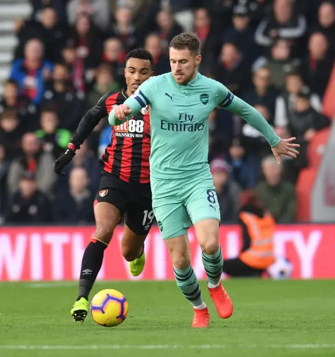 Framed Print : Arsenal's Aaron Ramsey Outmaneuvers Bournemouth's Junior Stanislas