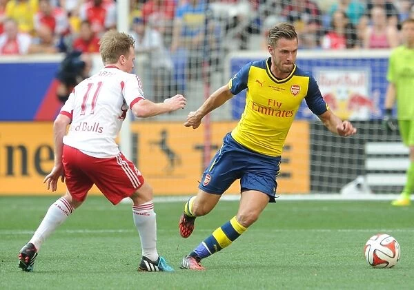 Arsenal's Aaron Ramsey Outmaneuvers Dax McCarty in New York Red Bulls Pre-Season Clash
