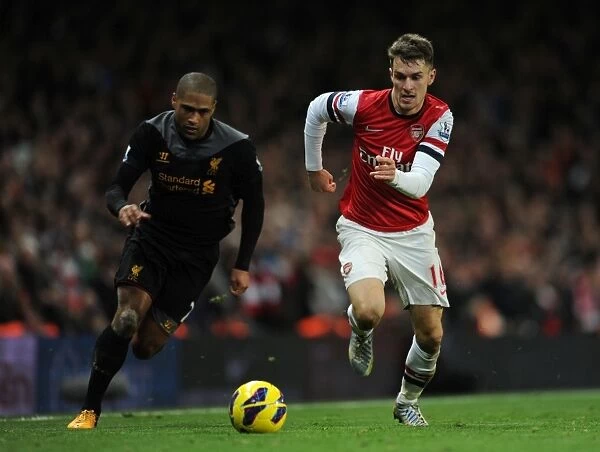 Arsenal's Aaron Ramsey Outmaneuvers Liverpool's Glen Johnson