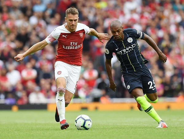 Arsenal's Aaron Ramsey Outmaneuvers Manchester City's Fernandinho in Premier League Showdown
