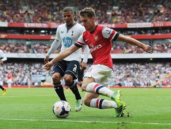 Arsenal's Aaron Ramsey Outmaneuvers Tottenham's Kyle Walker