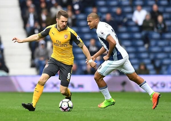 Arsenal's Aaron Ramsey Outmaneuvers West Brom's Solomon Rondon