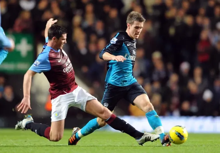 Framed Print : Arsenal's Aaron Ramsey Outmuscles Aston Villa's Ciaran Clark in Premier League Clash