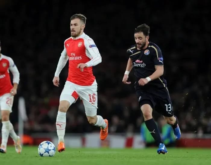 Framed Print : Arsenal's Aaron Ramsey Outruns Goncalo Santos: A Moment of Speed and Skill in the 2015-16 Champions League Clash Framed Print : Arsenal's Aaron Ramsey Outruns Goncalo Santos: A Moment of Speed and Skill in the 2015-16 Champions League Clash
