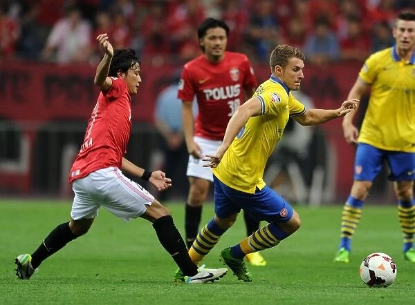 Arsenal's Aaron Ramsey Outruns Urawa Red Diamonds Shuto Kojima