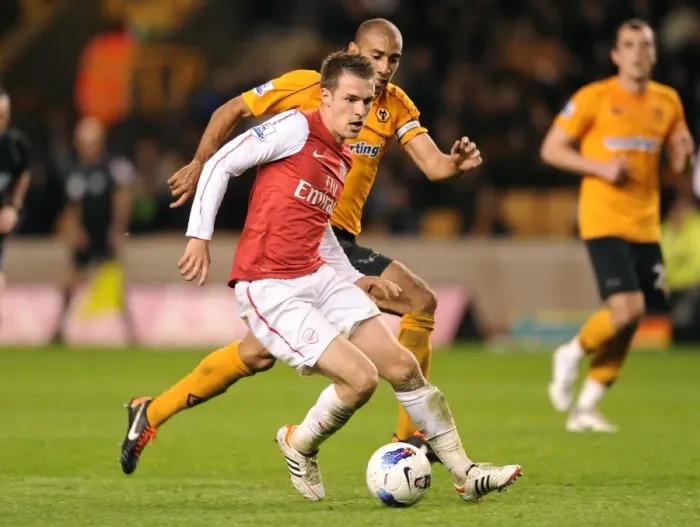 Framed Print : Arsenal's Aaron Ramsey Outsmarts Carl Henry: Premier League Showdown between Arsenal and Wolverhampton Wanderers (2012) Framed Print : Arsenal's Aaron Ramsey Outsmarts Carl Henry: Premier League Showdown between Arsenal and Wolverhampton Wanderers (2012)