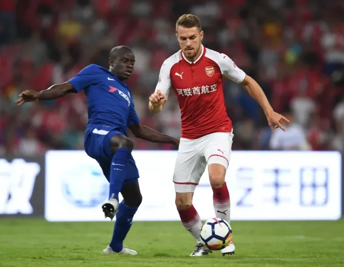 Framed Print : Arsenal's Aaron Ramsey Outsmarts Chelsea's N'Golo Kante: A Pre-Season Battle in Beijing