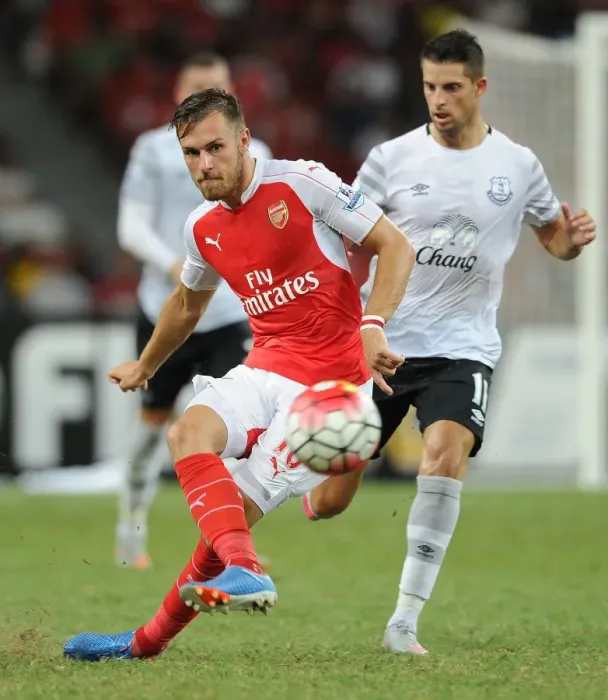 Framed Print : Arsenal's Aaron Ramsey Outsmarts Everton's Kevin Mirallas in Barclays Asia Trophy Clash Framed Print : Arsenal's Aaron Ramsey Outsmarts Everton's Kevin Mirallas in Barclays Asia Trophy Clash