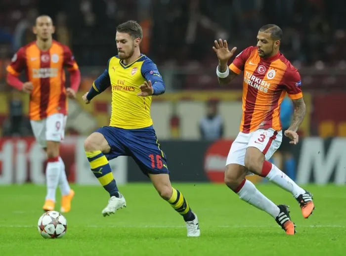 Framed Print : Arsenal's Aaron Ramsey Outsmarts Felipe Melo in UEFA Champions League Clash