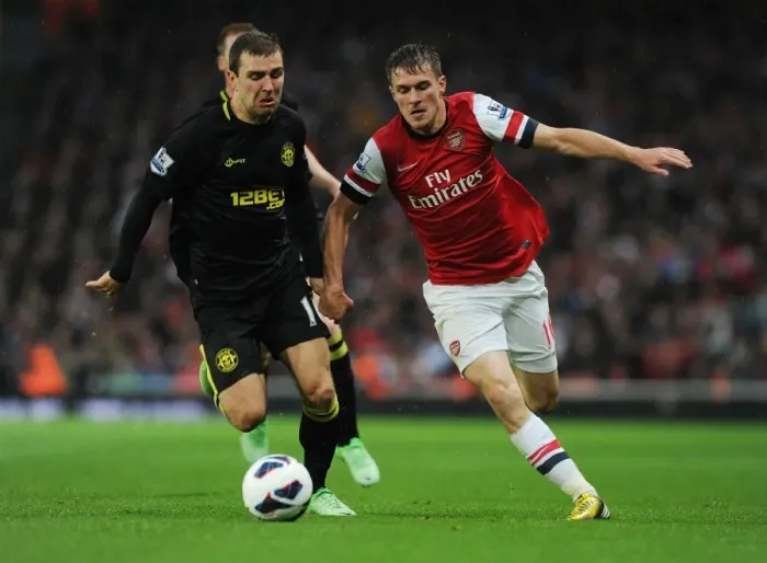 Framed Print : Arsenal's Aaron Ramsey Outsmarts James McArthur: The Skillful Pass at Emirates Stadium, 2013