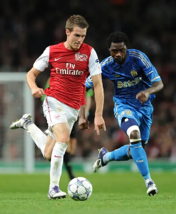 Framed Print : Arsenal's Aaron Ramsey Outsmarts Marseille's Koulouté in 2011-12 Champions League Showdown Framed Print : Arsenal's Aaron Ramsey Outsmarts Marseille's Koulouté in 2011-12 Champions League Showdown
