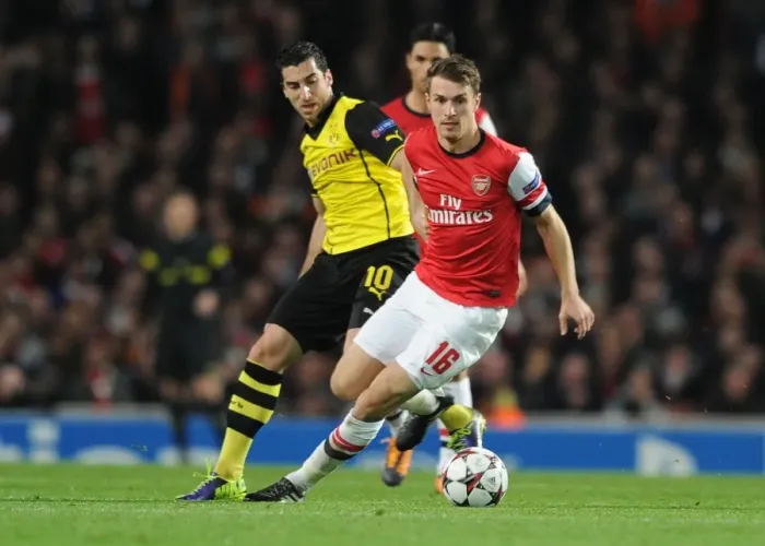 Framed Print : Arsenal's Aaron Ramsey Outwits Mkhitaryan in Thrilling 2013-14 Champions League Clash