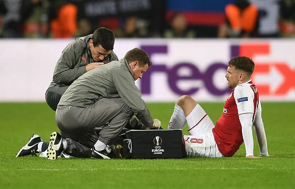 Arsenal's Aaron Ramsey Receives Medical Attention from Colin Lewin and Gary O'Driscoll during CSKA Moscow Match, UEFA Europa League 2018