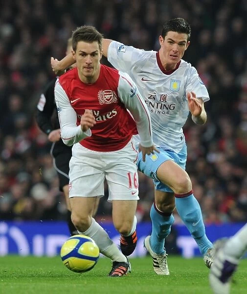 Arsenal's Aaron Ramsey Scores Past Aston Villa's Ciaran Clark in FA Cup Match