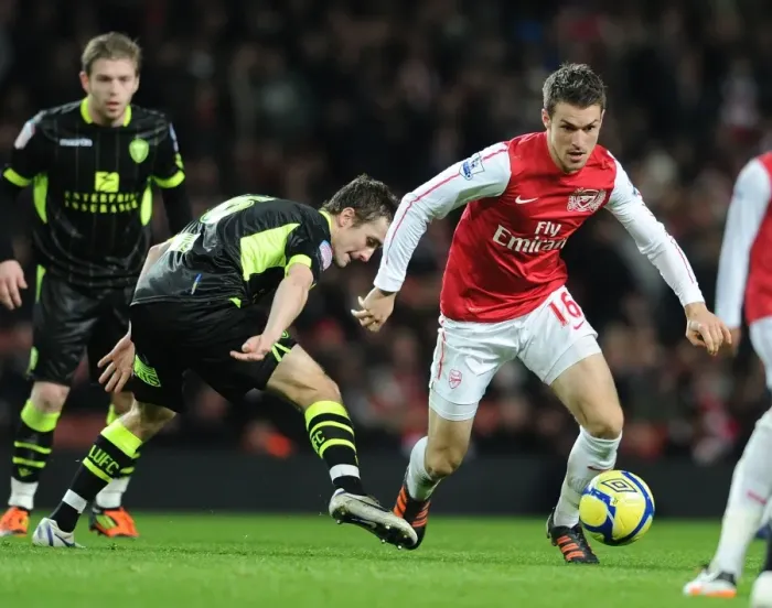 Framed Print : Arsenal's Aaron Ramsey Scores Past Leeds Danny Pugh in FA Cup Third Round Clash Framed Print : Arsenal's Aaron Ramsey Scores Past Leeds Danny Pugh in FA Cup Third Round Clash