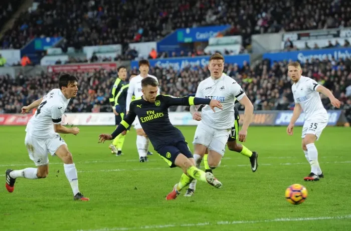 Framed Print : Arsenal's Aaron Ramsey Scores Under Pressure Against Swansea City (Swansea v Arsenal, Premier League 2016-17) Framed Print : Arsenal's Aaron Ramsey Scores Under Pressure Against Swansea City (Swansea v Arsenal, Premier League 2016-17)