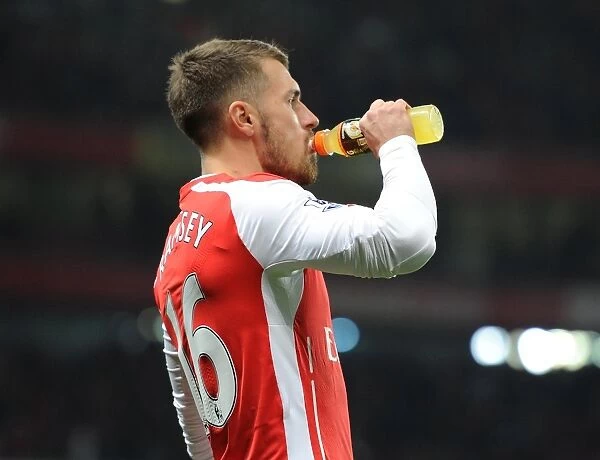 Arsenal's Aaron Ramsey Sips Gatorade Before Kickoff Against Manchester United in Emirates Stadium