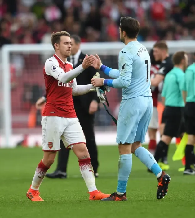 Framed Print : Arsenal's Aaron Ramsey and Swansea's Lukasz Fabianski Share a Moment After Match Framed Print : Arsenal's Aaron Ramsey and Swansea's Lukasz Fabianski Share a Moment After Match
