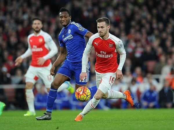 Arsenal's Aaron Ramsey vs. Chelsea's Jon Obi Mikel: Intense Clash in Premier League Showdown