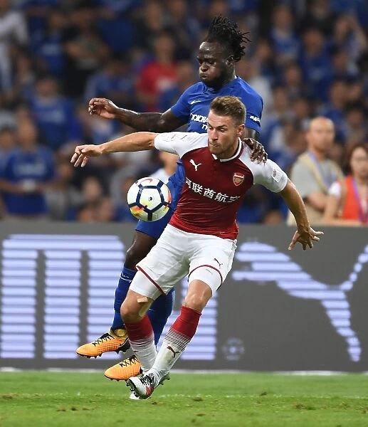 Arsenal's Aaron Ramsey vs. Chelsea's Victor Moses: A Battle in the Pre-Season Friendly in Beijing