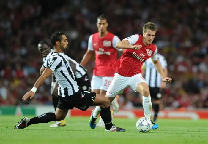 Framed Print : Arsenal's Aaron Ramsey vs. Medhi Benatia: Clash in the 2011 Champions League Play-Off Framed Print : Arsenal's Aaron Ramsey vs. Medhi Benatia: Clash in the 2011 Champions League Play-Off