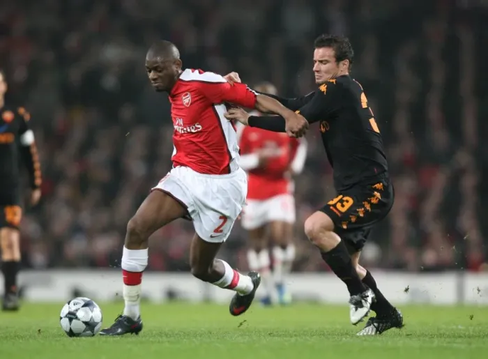 Framed Print : Arsenal's Abou Diaby Clashes with Matteo Brighi of AS Roma in the Champions League First Knockout Round 1st Leg at Emirates Stadium, 2009