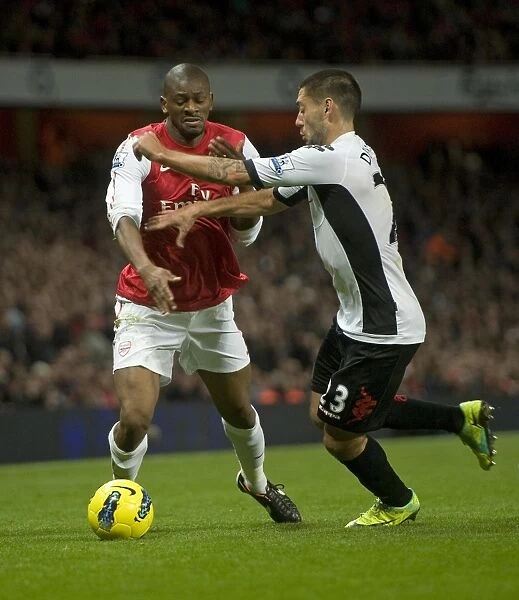 Arsenal's Abou Diaby Faces Off Against Fulham's Clint Dempsey during the 2011-12 Premier League Match