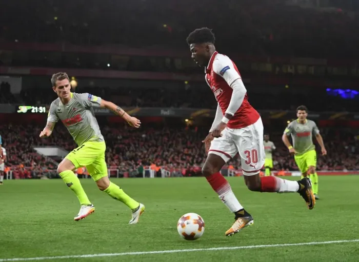 Framed Print : Arsenal's Ainsley Maitland-Niles Clashes with Simon Zoller of FC Köln in Europa League Action Framed Print : Arsenal's Ainsley Maitland-Niles Clashes with Simon Zoller of FC Köln in Europa League Action