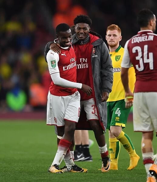 Arsenal's Ainsley Maitland-Niles and Eddie Nketiah Celebrate Carabao Cup Victory over Norwich City