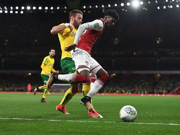 Arsenal's Ainsley Maitland-Niles Faces Off Against Norwich's Ivo Pinto in Carabao Cup Clash