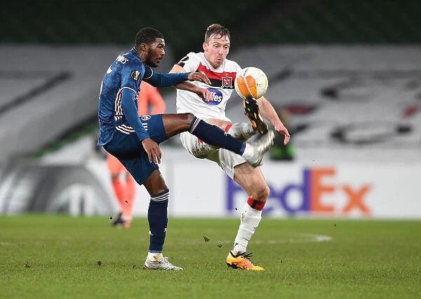 Arsenal's Ainsley Maitland-Niles Faces Off Against Dundalk's Sean Gannon in UEFA Europa League Clash