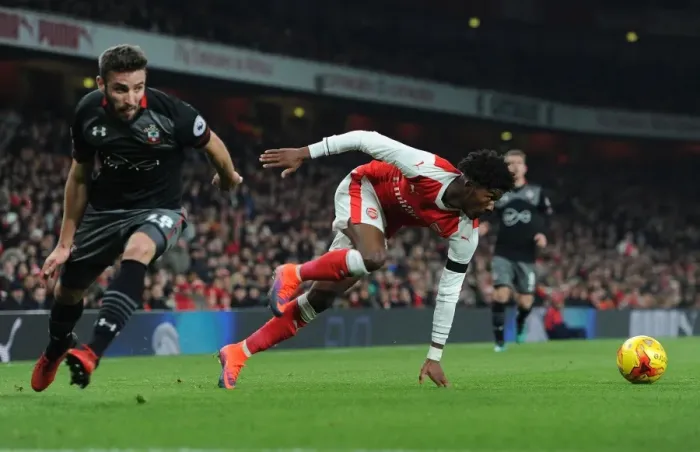 Framed Print : Arsenal's Ainsley Maitland-Niles Faces Off Against Southampton's Sam McQueen in EFL Cup Quarter-Final Framed Print : Arsenal's Ainsley Maitland-Niles Faces Off Against Southampton's Sam McQueen in EFL Cup Quarter-Final