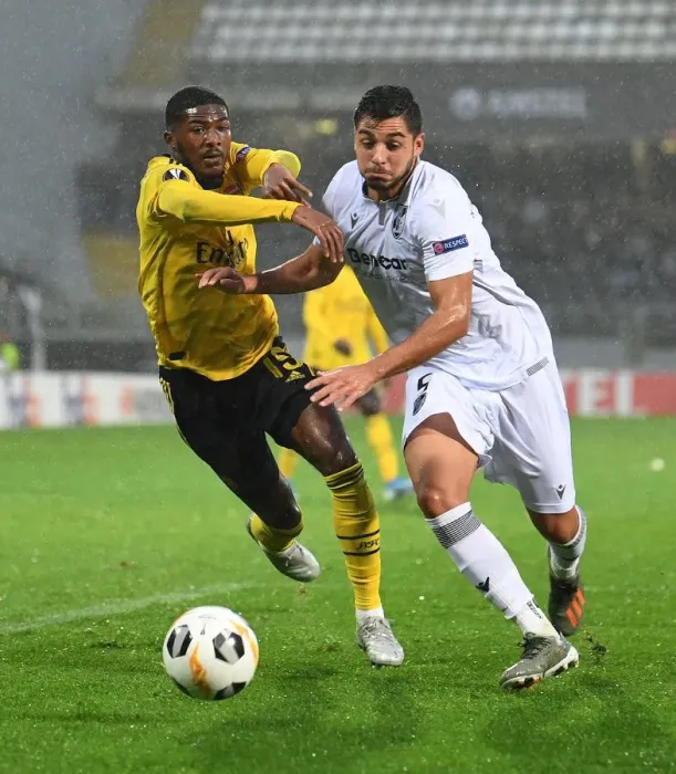 Framed Print : Arsenal's Ainsley Maitland-Niles Faces Off Against Vitoria Guimaraes Rafa Soares in Europa League Clash Framed Print : Arsenal's Ainsley Maitland-Niles Faces Off Against Vitoria Guimaraes Rafa Soares in Europa League Clash