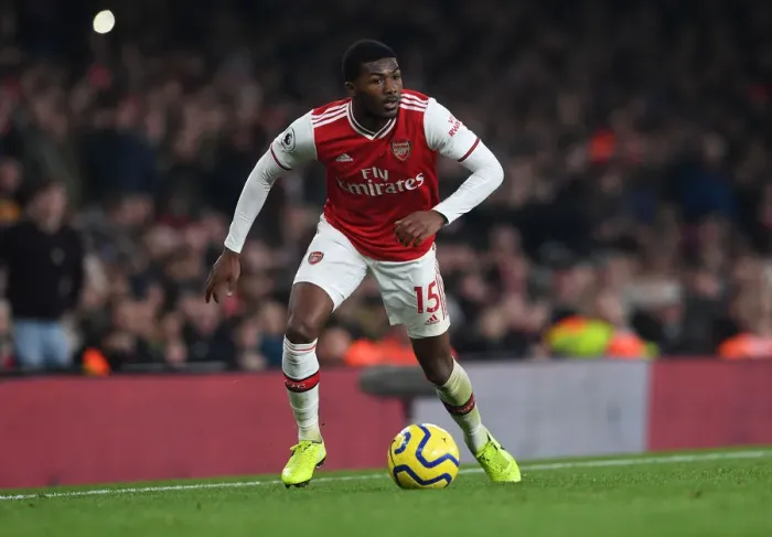 Framed Print : Arsenal's Ainsley Maitland-Niles Goes Head-to-Head with Manchester United in Premier League Showdown (2019-20)