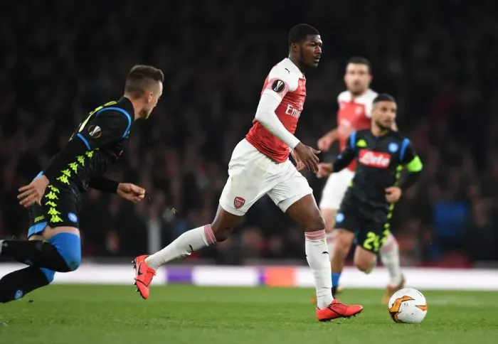 Framed Print : Arsenal's Ainsley Maitland-Niles Outsmarts Napoli's Mario Rui in Europa League Showdown Framed Print : Arsenal's Ainsley Maitland-Niles Outsmarts Napoli's Mario Rui in Europa League Showdown