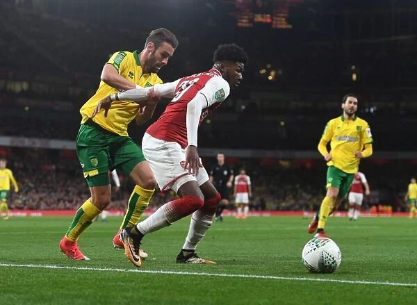 Arsenal's Ainsley Maitland-Niles vs. Norwich's Ivo Pinto: A Carabao Cup Battle at Emirates Stadium