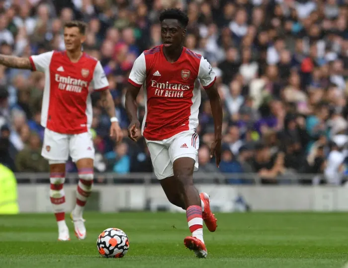 Framed Print : Arsenal's Albert Sambi Lokonga: Unwavering Concentration Amidst Premier League Rivalry (Arsenal vs. Tottenham Hotspur)