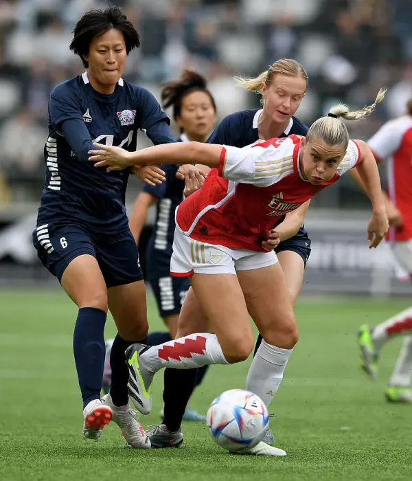 Framed Print : Arsenal's Alessia Russo Clashes with Soari Takarada in UEFA Champions League Showdown