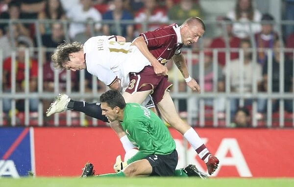 Arsenal's Alex Hleb Faces Off Against Sparta Prague's Tomas Repka and Tomas Postulka in Champions League Clash