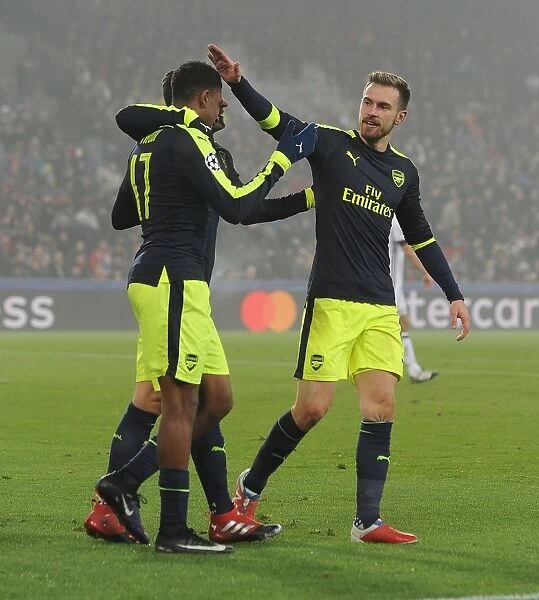 Arsenal's Alex Iwobi and Aaron Ramsey Celebrate Goals Against FC Basel in 2016-17 UEFA Champions League