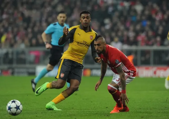 Framed Print : Arsenal's Alex Iwobi Battles Arturo Vidal in UEFA Champions League Showdown: Bayern Munich vs. Arsenal (2016-17) Framed Print : Arsenal's Alex Iwobi Battles Arturo Vidal in UEFA Champions League Showdown: Bayern Munich vs. Arsenal (2016-17)