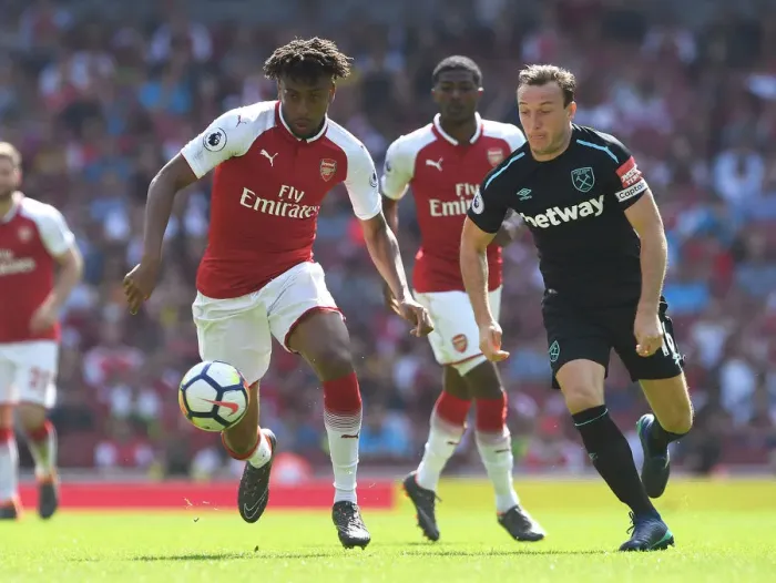 Framed Print : Arsenal's Alex Iwobi Chases Down West Ham's Mark Noble in Intense Premier League Clash