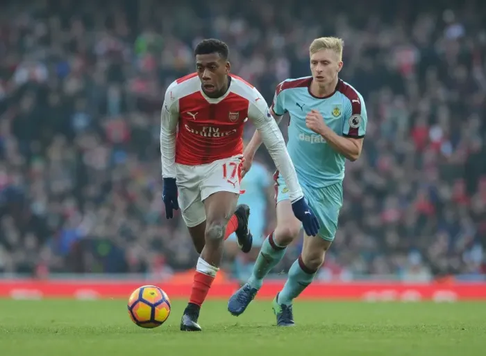 Framed Print : Arsenal's Alex Iwobi Clashes with Burnley's Ben Mee in Premier League Showdown Framed Print : Arsenal's Alex Iwobi Clashes with Burnley's Ben Mee in Premier League Showdown