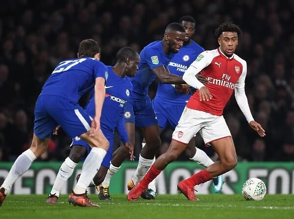 Arsenal's Alex Iwobi Clashes with Chelsea's Rudiger and Kante in Carabao Cup Semi-Final