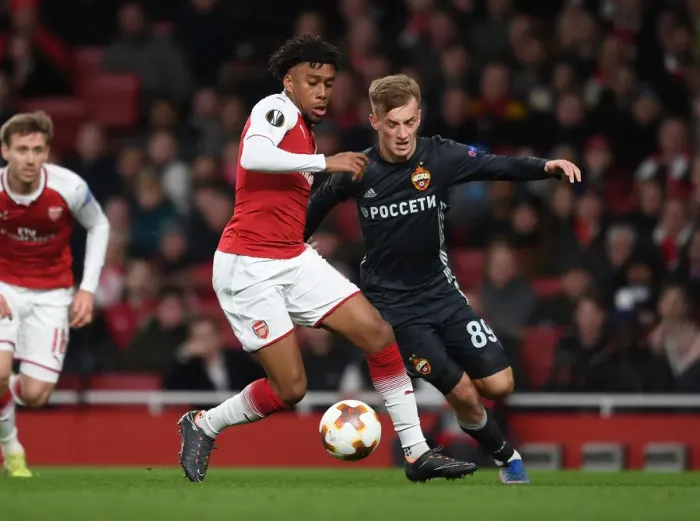 Framed Print : Arsenal's Alex Iwobi Clashes with CSKA Moscow's Konstantin Kuchaev in Europa League Quarterfinal