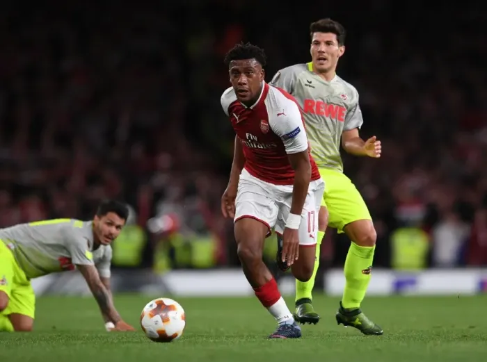 Framed Print : Arsenal's Alex Iwobi Clashes with FC Köln's Leonardo Bittencourt and Milos Jojic in Europa League Battle