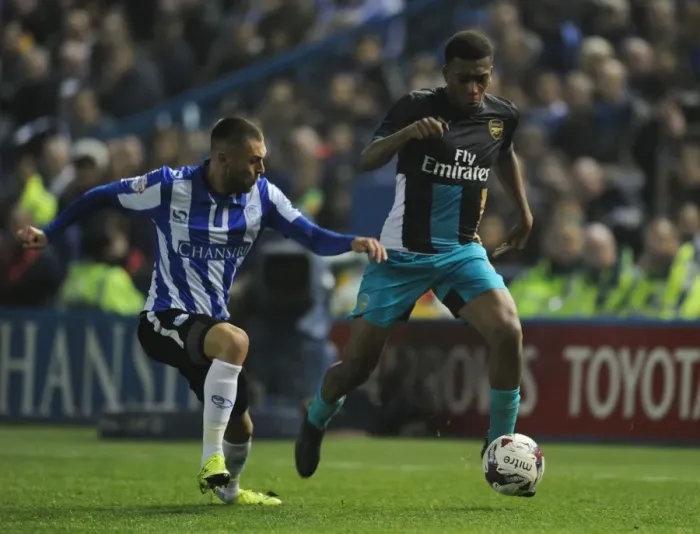 Framed Print : Arsenal's Alex Iwobi Clashes with Jack Hunt in Capital One Cup Battle Framed Print : Arsenal's Alex Iwobi Clashes with Jack Hunt in Capital One Cup Battle