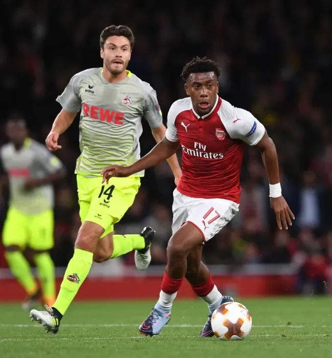 Framed Print : Arsenal's Alex Iwobi Clashes with Jonas Hector in Europa League Showdown