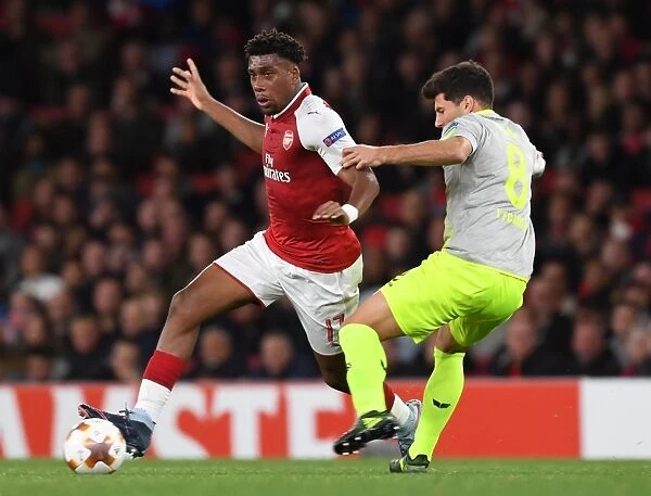 Arsenal's Alex Iwobi Clashes with Milos Jojic in UEFA Europa League Match
